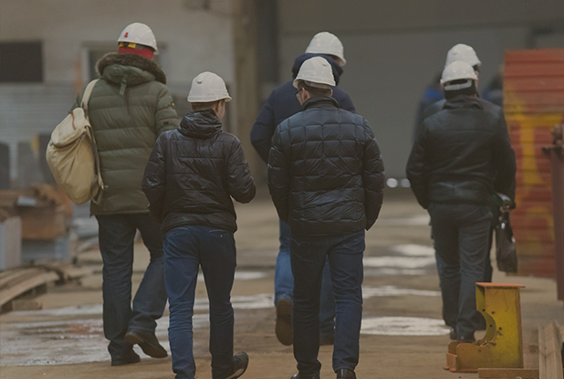 A team of supervisors walking on site